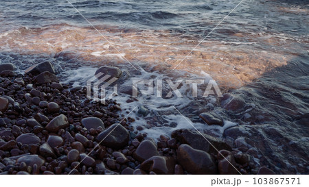 Slow motion closeup shot of clear sea water on Saint Raphael beach Slow motion closeup shot of clear sea water on Saint Raphael beach 103867571