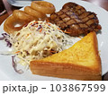 Chicken Steak Vegetable Salad Fried Onion Garlic Bread on White Plate. 103867599