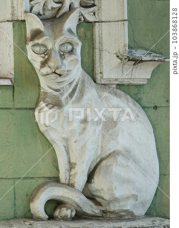 Kiev, Ukraine June 10, 2021: Facade of a building decorated with a plaster cat in the center of Kiev 103868128
