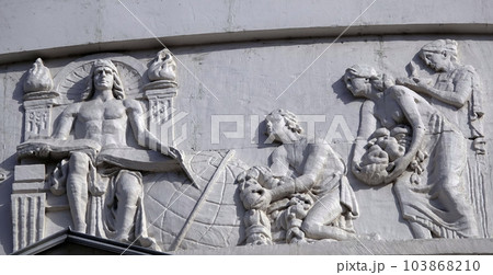 Kiev, Ukraine April 13, 2021: Architectural decorations, frescoes on a building with different subjects from ancient legends in the city of Kiev Kiev, Ukraine April 13, 2021: Architectural decorations, frescoes on a building with different subjects from ancient legends in the city of Kiev 103868210