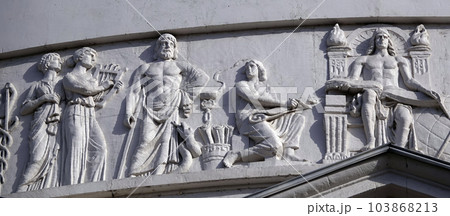 Kiev, Ukraine April 13, 2021: Architectural decorations, frescoes on a building with different subjects from ancient legends in the city of Kiev Kiev, Ukraine April 13, 2021: Architectural decorations, frescoes on a building with different subjects from ancient legends in the city of Kiev 103868213