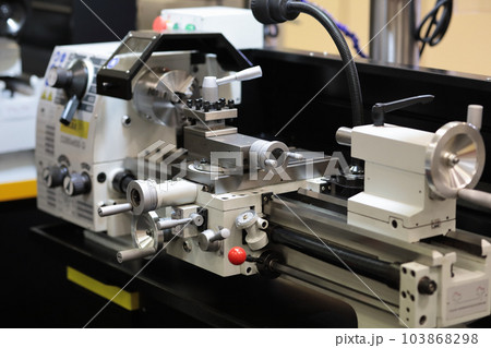 conventional metalworking lathe in a workshop conventional metalworking lathe in a workshop 103868298
