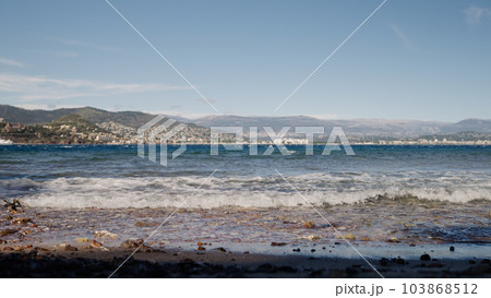 Warm spring day on Theoule-Sur-Mer beach in spring Warm spring day on Theoule-Sur-Mer beach in spring 103868512