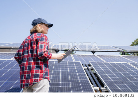 Woman with solar power station 103869132