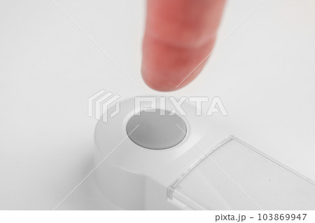 Patient hand pressing emergency nurse call button for help close up. Assistance concept Patient hand pressing emergency nurse call button for help close up. Assistance concept 103869947