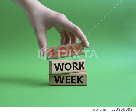 4-day work week symbol. Concept words 4-day work week on wooden blocks. Beautiful green background. Businessman hand. Business and 4-day work week concept. Copy space 103869988