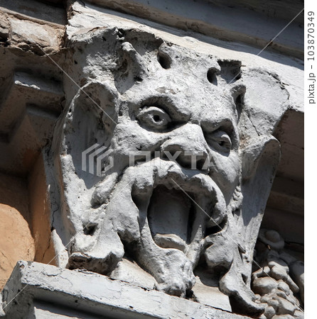 Kiev, Ukraine June 10, 2020: Artistic decoration of the facade of the building with sculptures of people in the city of Kiev Kiev, Ukraine June 10, 2020: Artistic decoration of the facade of the building with sculptures of people in the city of Kiev 103870349