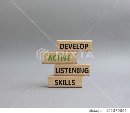 Listening skills symbol. Concept word Develop active listening skills on wooden blocks. Beautiful grey background. Business and Develop active listening skills concept. Copy space Listening skills symbol. Concept word Develop active listening skills on wooden blocks. Beautiful grey background. Business and Develop active listening skills concept. Copy space 103870805