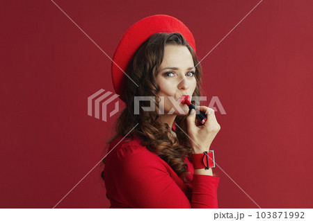 stylish woman in dress and beret isolated on background stylish woman in dress and beret isolated on background 103871992