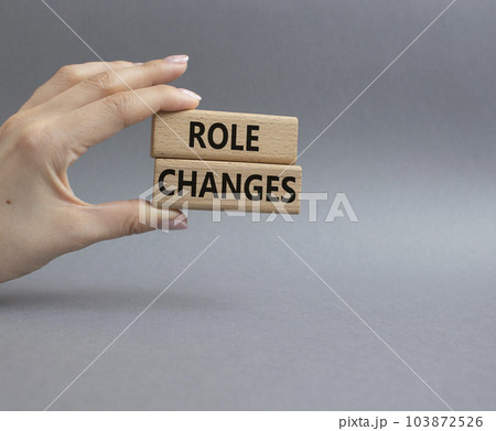 Role changes symbol. Concept words Role changes on wooden blocks. Beautiful grey background. Businessman hand. Business and Role changes concept. Copy space. 103872526
