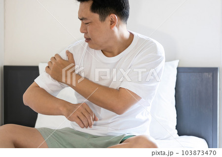 Asian middle aged man suffering from pain in shoulder,Subscapularis tendinitis,Rotator cuff tear or degeneration,tired male patient with shoulder osteoarthritis or rheumatoid arthritis,health problems Asian middle aged man suffering from pain in shoulder,Subscapularis tendinitis,Rotator cuff tear or degeneration,tired male patient with shoulder osteoarthritis or rheumatoid arthritis,health problems 103873470