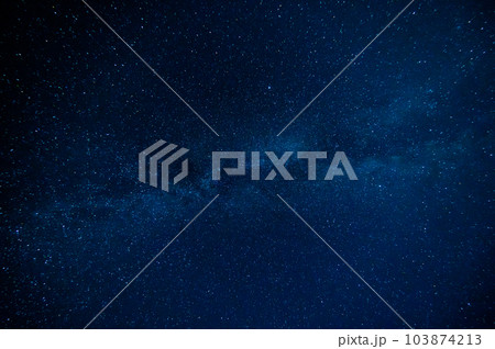 Starry Milky Way at night with stars on background of a dark blue night sky Starry Milky Way at night with stars on background of a dark blue night sky 103874213
