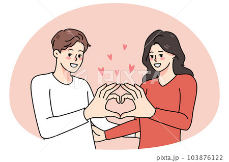 Happy couple show heart hand gesture 103876122
