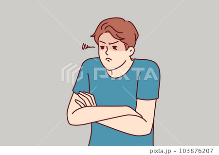 Angry man with hands folded in front of chest demonstrates envy and indignation. Angry man with hands folded in front of chest demonstrates envy and indignation. 103876207