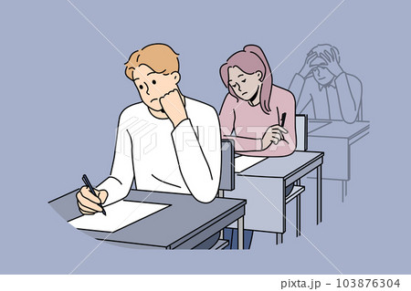Distressed students write on exam in school Distressed students write on exam in school 103876304