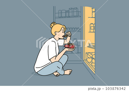 Woman near fridge eating at night Woman near fridge eating at night 103876342
