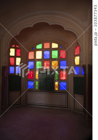 Colourful small windows, interiors of the Hawa Mahal (Wind Palace), is a palace built from red and pink sandstone, Jaipur, Rajasthan, India Colourful small windows, interiors of the Hawa Mahal (Wind Palace), is a palace built from red and pink sandstone, Jaipur, Rajasthan, India 103877343