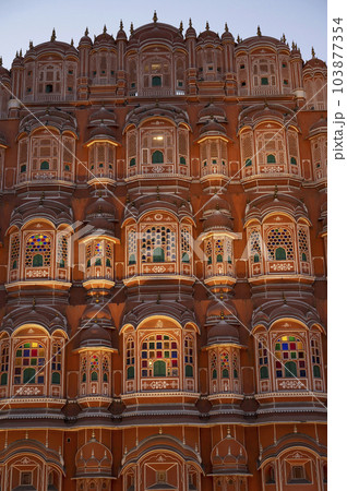 Exteriors of the Hawa Mahal or Wind Palace, built from red and pink sandstone. It is akin to a honeycomb with its 953 small windows called Jharokhas decorated with intricate latticework, Jaipur, Exteriors of the Hawa Mahal or Wind Palace, built from red and pink sandstone. It is akin to a honeycomb with its 953 small windows called Jharokhas decorated with intricate latticework, Jaipur, 103877354