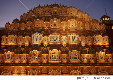 Exteriors of the Hawa Mahal or Wind Palace, built from red and pink sandstone. It is akin to a honeycomb with its 953 small windows called Jharokhas decorated with intricate latticework, Jaipur, 103877356