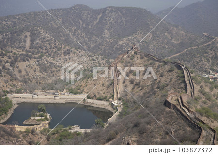 Sagar Lake and fortification wall of Jaigarh Fort situated on Cheel ka Teela or Hill of Eagles of the Aravalli range, it overlooks the Amer Fort and the Maota Lake, near Amer Jaipur, Rajasthan, India Sagar Lake and fortification wall of Jaigarh Fort situated on Cheel ka Teela or Hill of Eagles of the Aravalli range, it overlooks the Amer Fort and the Maota Lake, near Amer Jaipur, Rajasthan, India 103877372