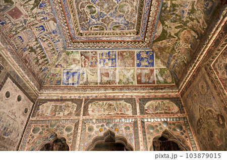 Colourful mythological paintings and mirror work on the ceiling of a small Shani Mandir, located in Ramgarh, Shekhawati, Rajasthan, India Colourful mythological paintings and mirror work on the ceiling of a small Shani Mandir, located in Ramgarh, Shekhawati, Rajasthan, India 103879015