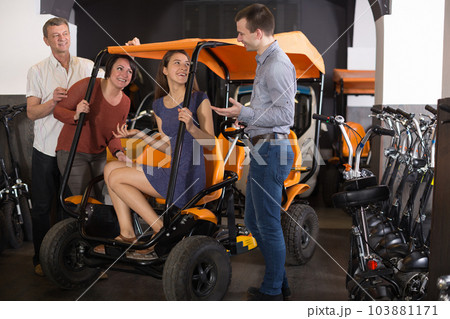 family of tourists of different generations hire bike carriage family of tourists of different generations hire bike carriage 103881171