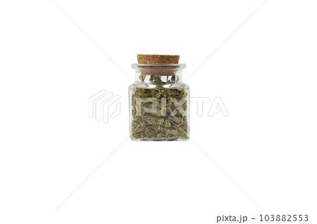 Dried leaves o Lemon verbena in latin Aloysia citrodora in a glass jar isolated on white background. Medicinal herb. 103882553