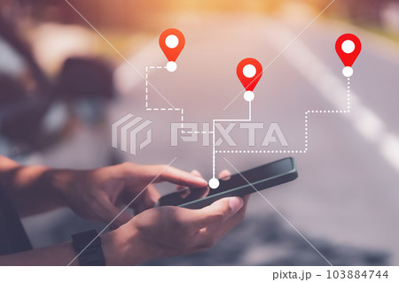 Man hand using smartphone with gps navigator map icon on blur street background. Technology lifestyle and business travel concept. Vintage filter effect color style. Man hand using smartphone with gps navigator map icon on blur street background. Technology lifestyle and business travel concept. Vintage filter effect color style. 103884744
