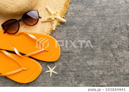 Summer vacation concept flat lay. straw hat beach accessories and towel top view. Space for text. travel concept 103884941