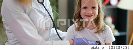 Cheerful little child at doctor pediatrician appointment 103887255