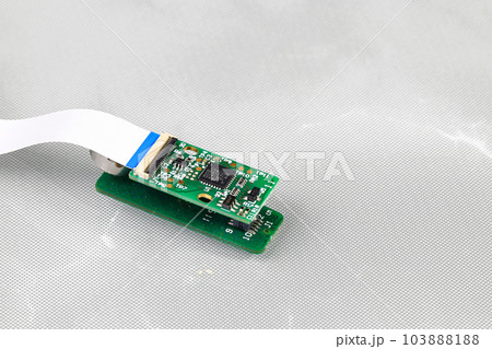 tiny circuit board, IOT device, micro controller or nano computer circuit board running on wire connection with red lamp status isolate on white background. tiny circuit board, IOT device, micro controller or nano computer circuit board running on wire connection with red lamp status isolate on white background. 103888188