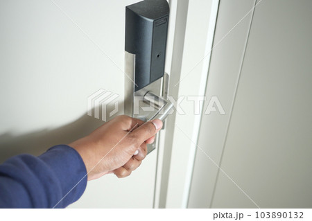 Man's Hand Opening door close up  103890132
