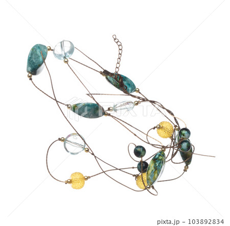 Silver wire jewel bead style necklet fly in air. Jewelry bead necklace as gemstone for fashion ornament decorative items. Fashion ornament necklace to add more style. White background isolated Silver wire jewel bead style necklet fly in air. Jewelry bead necklace as gemstone for fashion ornament decorative items. Fashion ornament necklace to add more style. White background isolated 103892834