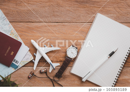 Travel accessories costumes. The cost of travel maps prepared for the trip.travel planning concept. Travel accessories costumes. The cost of travel maps prepared for the trip.travel planning concept. 103893189