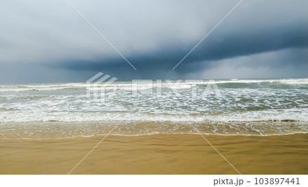 Beautiful waves on the sand beach 103897441