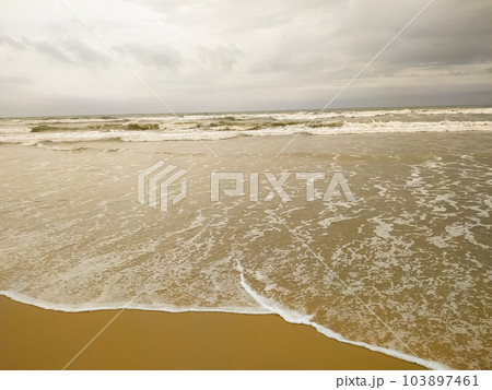 Summer beach concept - Soft wave of sea on empty sandy beach Background 103897461