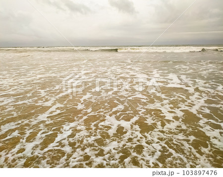 Amazing wave of the sea on the sand beach Amazing wave of the sea on the sand beach 103897476