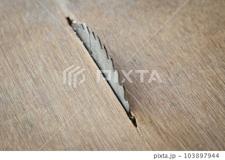 sharp metal saw on wood plank texture background, construction machine sharp metal saw on wood plank texture background, construction machine 103897944