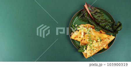 Omelet with greens, space for text 103900319