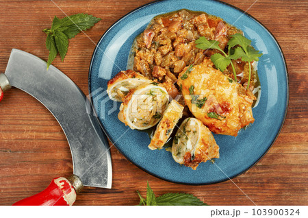 Baked squid stuffed with rice. Baked squid stuffed with rice. 103900324