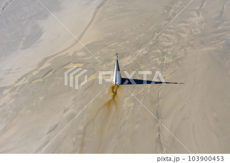 Aerial apocalyptic scene, church tower with cross buried under mud and toxic copper mining residuals Aerial apocalyptic scene, church tower with cross buried under mud and toxic copper mining residuals 103900453
