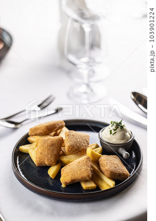 Breaded fried cheese with chips and mayonnaise 103901224