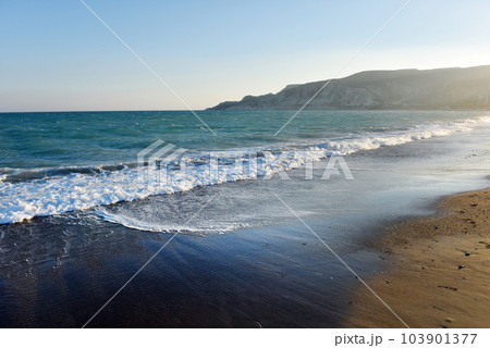 Sea waves and beach at sunset 103901377