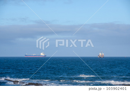 Freighter sailing at sea. 103902401