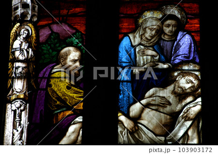 Stained glass window detail with Biblical scene 103903172