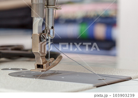 Sewing machine needle with thread and fabric 103903239