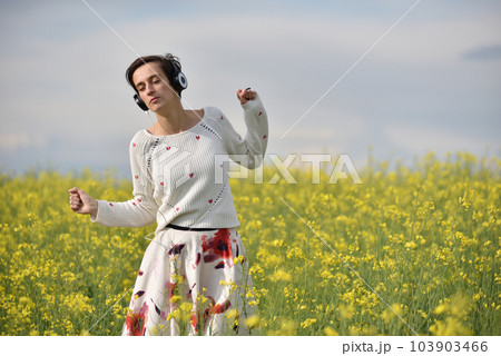Young woman with headphones Young woman with headphones 103903466