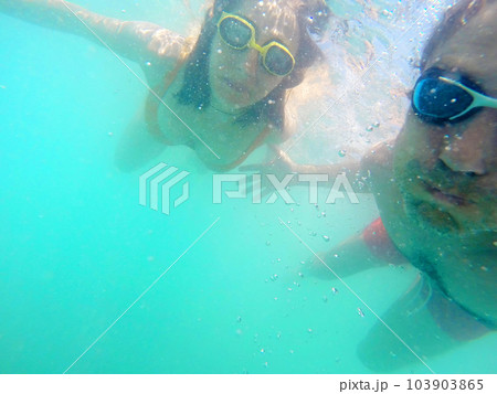 Couple having fun underwater in the sea 103903865