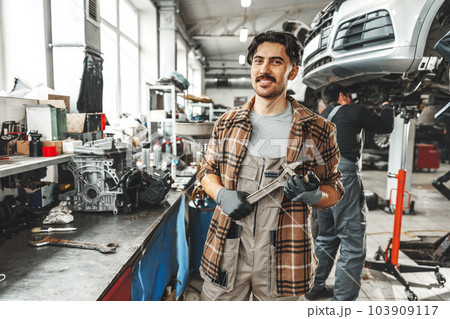 Portrait of a male mechanic in an auto repair shop 103909117
