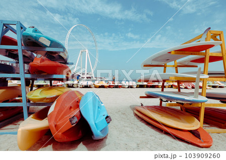 Surfboards stacked on the rack on a beach Surfboards stacked on the rack on a beach 103909260
